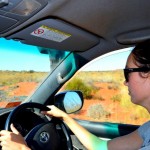 Tara driving in the Simpson Desert